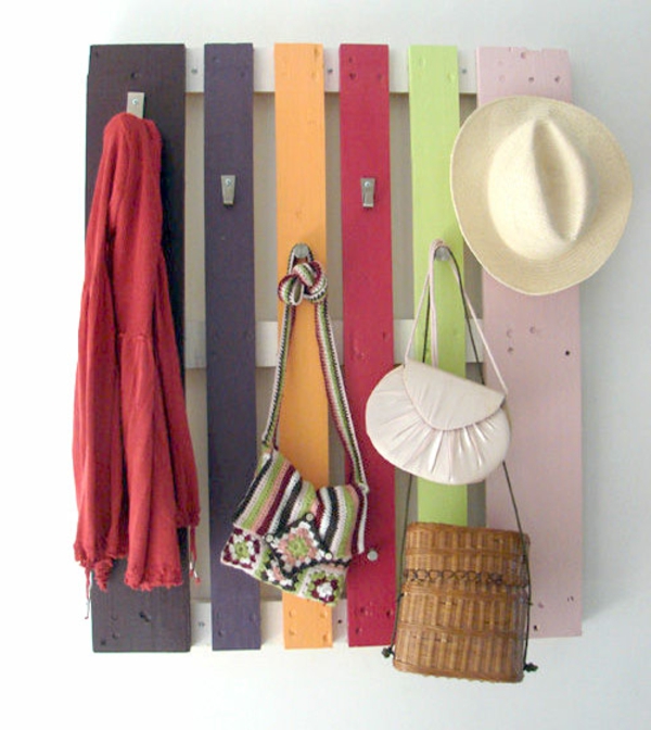DIY furniture made of europallets colorful plates hangers hallway
