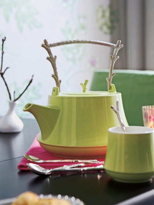 Pitcher interior decoration with branches table green spoon