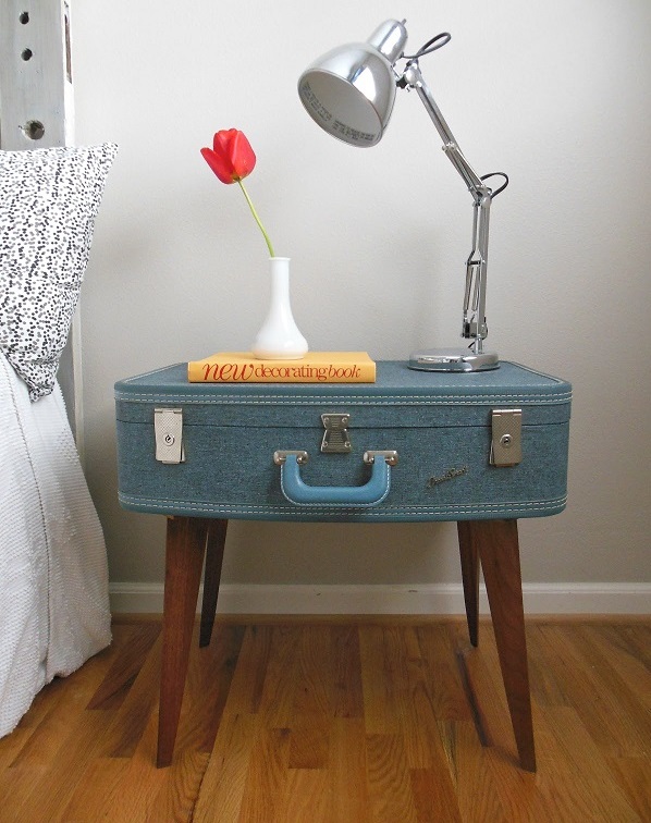 Trendy furniture made of old suitcases themselves make legs nightstand blue color