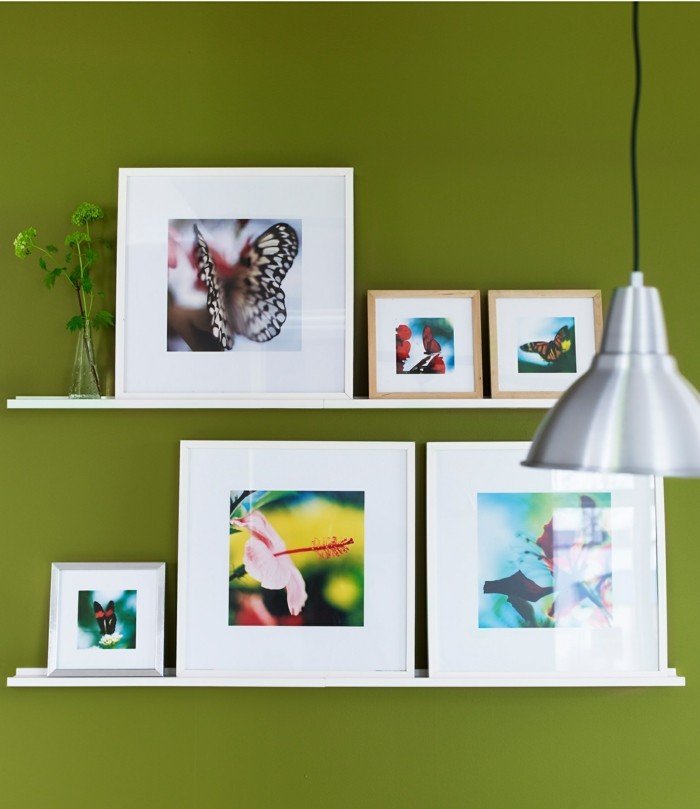 picture frames murals decorating green wall