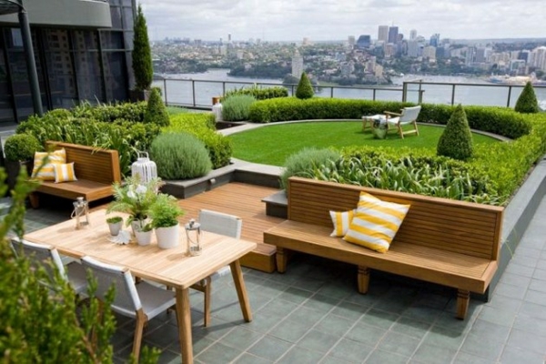 Roof terrace design roof turf lawn wood furniture bench dining table with chairs concrete slabs