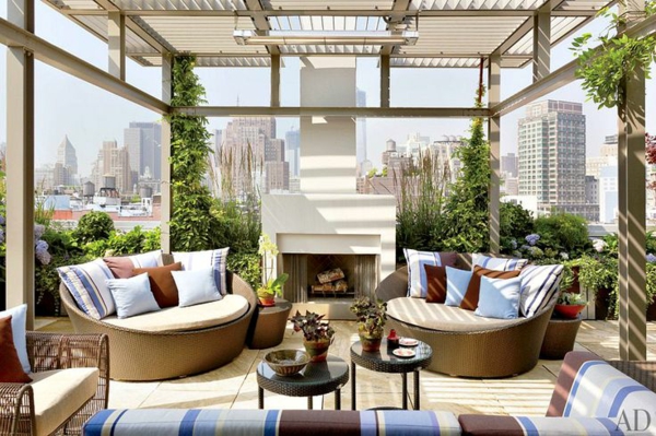 roof terrace design-ideas-pergola-creeper-rattan-furniture-fireplace-city view