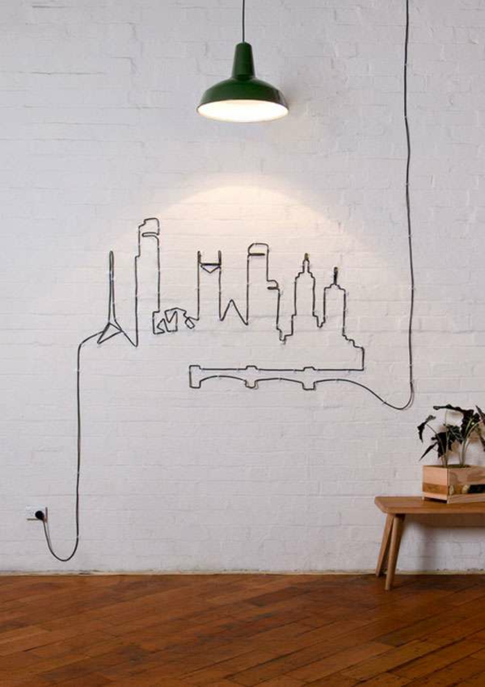 רעיונות לקשט כבלים יצירתיים מסתתרים על הקיר