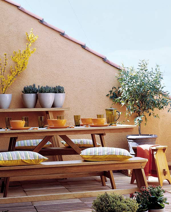 balcony set up wood tableware pillows yellow