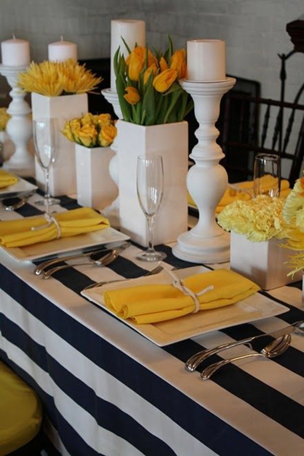 elegantiška stalelio apdaila su tulpių gėlėmis, išdėstytomis apdailos stale geltonai