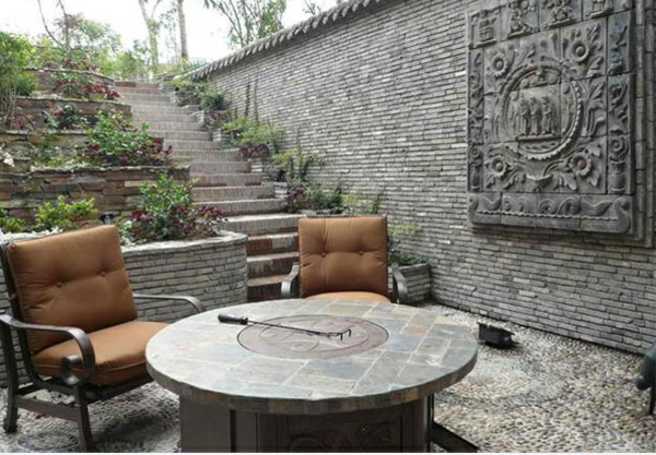 exterieur ideeën aziatische tuin patio stenen vloer fauteuil