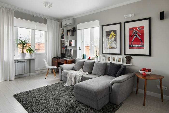 kleurstelling woonkamer lichtgrijs muurverf grijs meubilair grijs tapijt