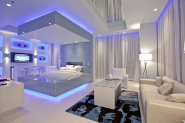 φουτουριστικό υπνοδωμάτιο μπλε νέον φως βελούδινο γυαλιστερό καναπέ