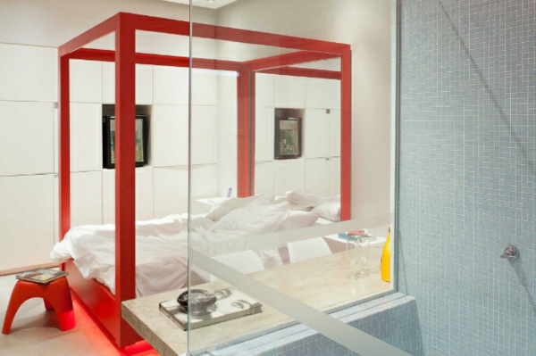 Φουτουριστικό υπνοδωμάτιο σχεδιάζει κρεβάτι στο φλογερό κόκκινο ξύλο