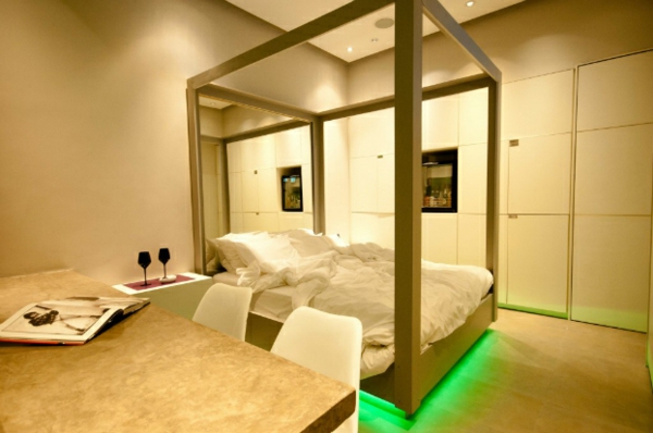 φουτουριστικό υπνοδωμάτιο σχεδιάζει πράσινο φως νέον κάτω από το κρεβάτι