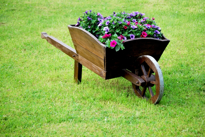 gardening old wheelbarrow upcycling ideas planter summer flowers petunia
