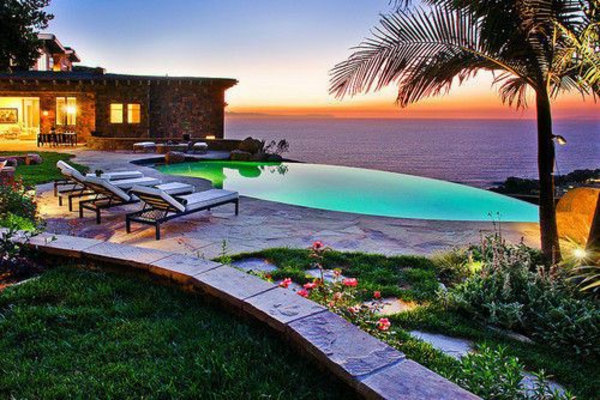 garden pool next to sea build palms