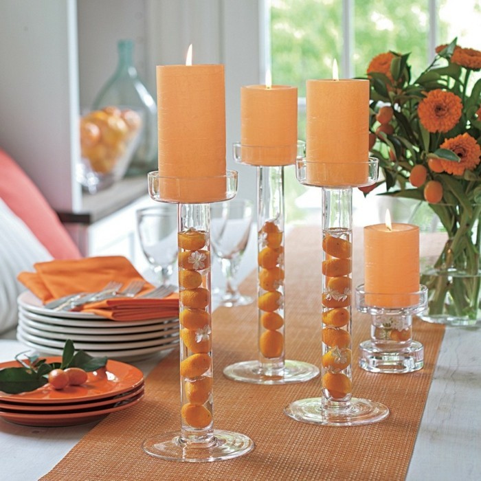 lysestaker håndverk glass bord dekorasjon ideer oransje aksenter