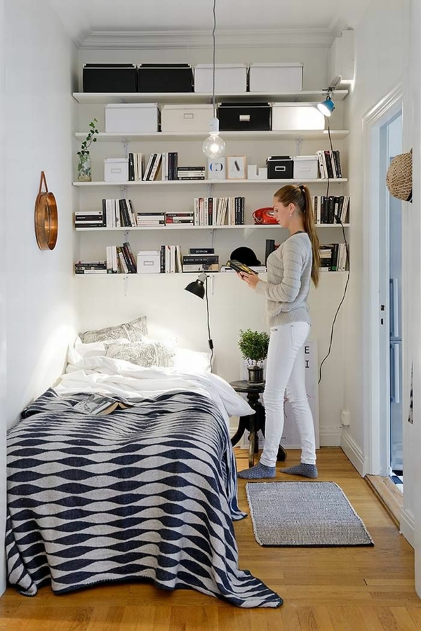 small bedroom set up open wall shelves