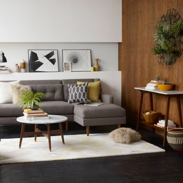 perete modern de design cameră de zi canapea cafea masă rotund plante de interior