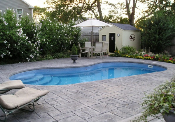 kidney shaped garden pool concrete slabs garden shed