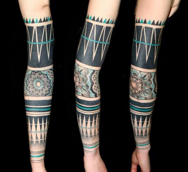 tribal floral motifs upper arm tattoo