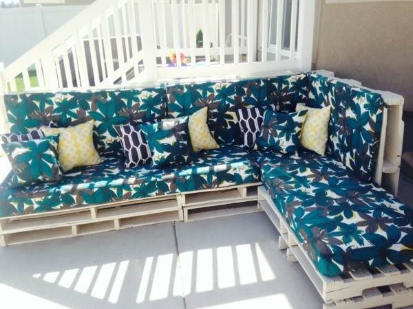 build a pallet sofa yourself with upholstery and pillows