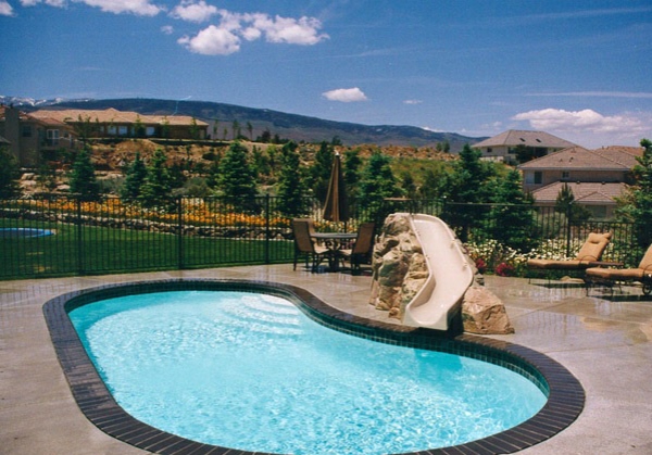 pool in garden kidney shaped with chute seating area design reclining garden furniture