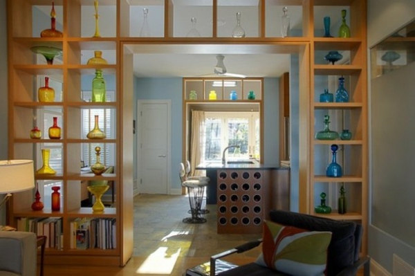 shelves as an original partition plain and full of colorful glass and vases