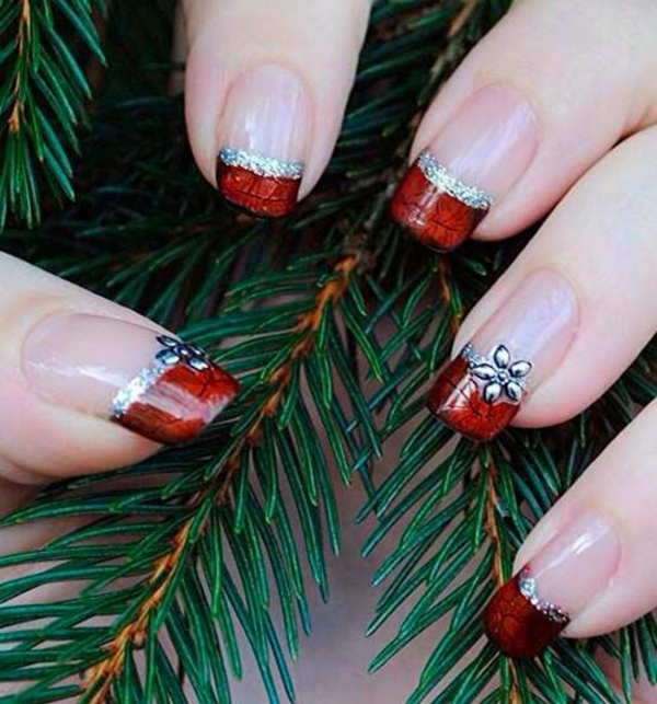 red gel nails painted for Christmas red fingernails branches fir