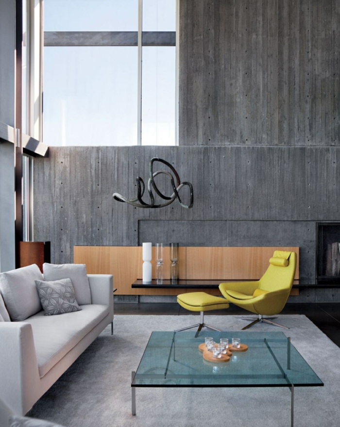 kaunis olohuone olohuone betoniseinä lasi sohvapöytä vaalea harmaa matto