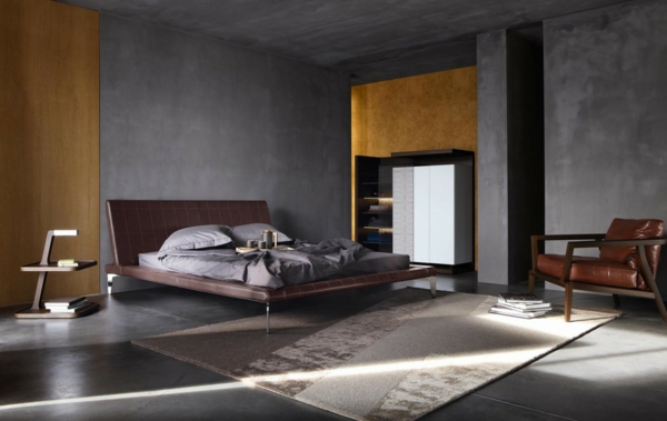 cama de diseño de dormitorio cabecero de cuero sillón de cuero alfombra elegante