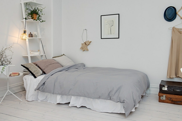 ložnice nápady skandinávský styl postel zdivo dekorace vnitřní rostliny