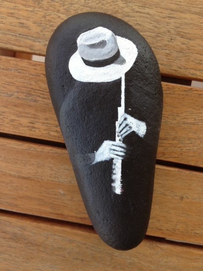 silhouette motif musicien pierres pierres peintes idée