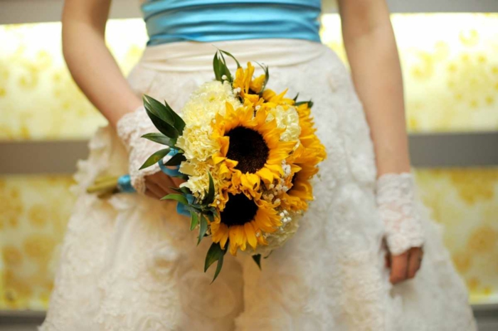 向日葵黄色康乃馨花束的崇高的新娘