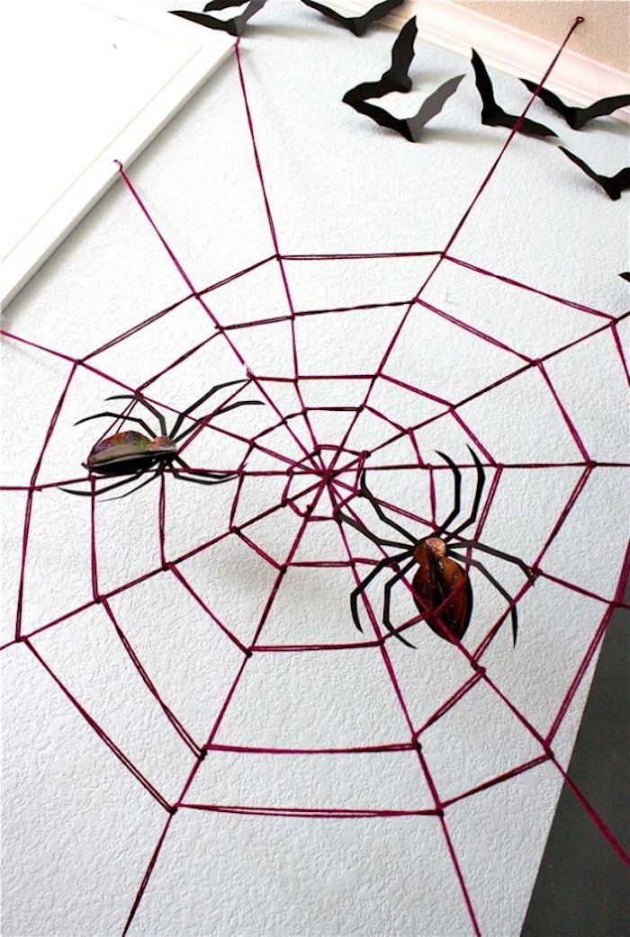 Spider webs make themselves with spiders as halloween decoration