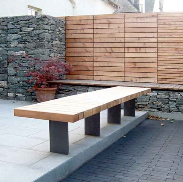 mur en pierre éléments en bois jardin design banc en béton
