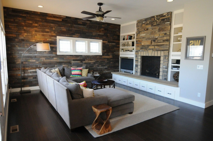 stone wall living room accent wall rustic side table carpet