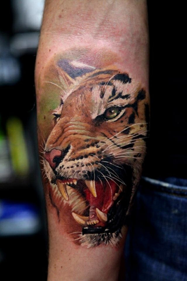tattoo upper arm wild animal motifs