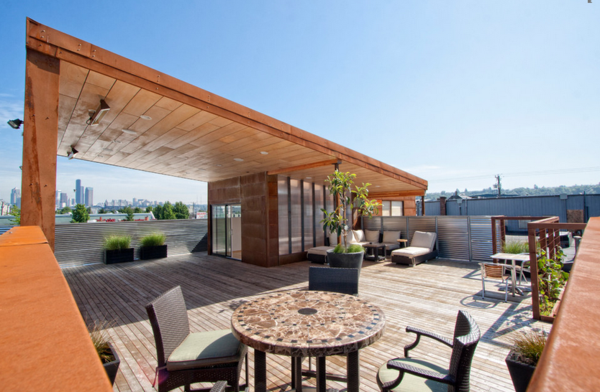 Terrasse design exemples rotin meubles chaises intimité protection solaire plancher de bois terrasse
