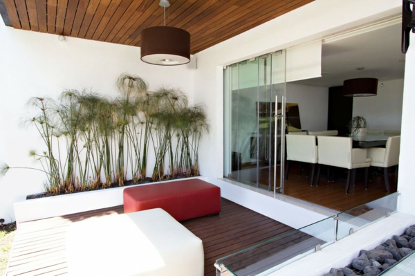 terrace design examples decking glass sliding door upholstered furniture stool plants