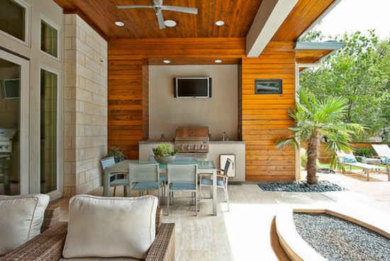 ideas de diseño de terraza porche muebles de ratán palma pavimento de piedra de grava