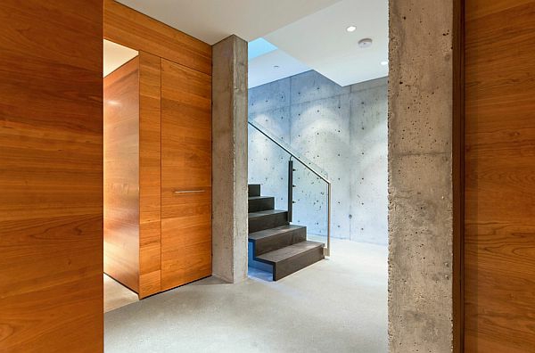מדרגות בטון קיר עיצוב זכוכית מעקה בטון חשוף בבית