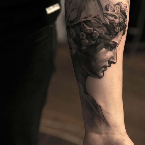 template statue roman upper arm and forearm tattoo ideas