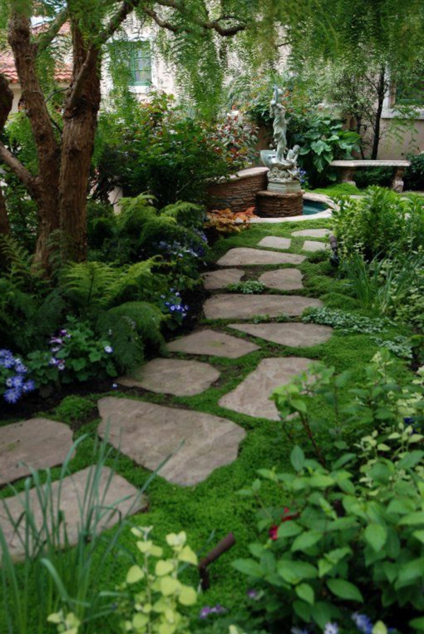 přední zahrada terénní úpravy zahradní cesta kamenné desky rostlin