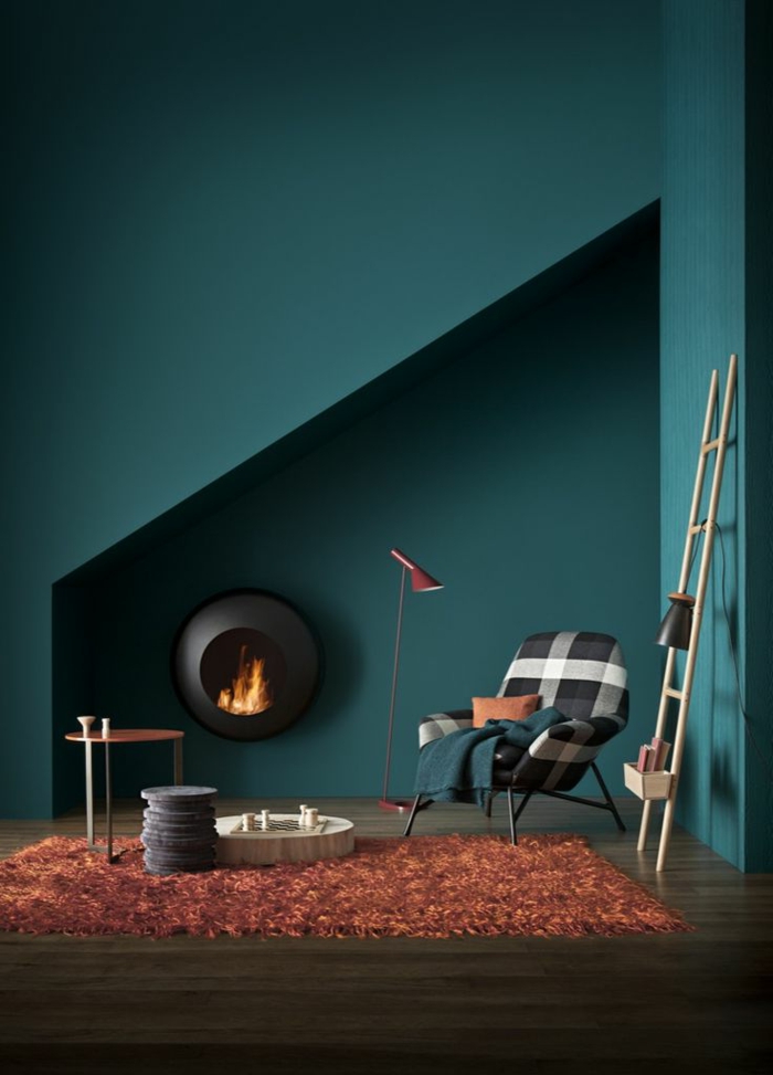 wanfarben ideeën donkergroene muurverf oranger tapijt moderne open haard woonkamer