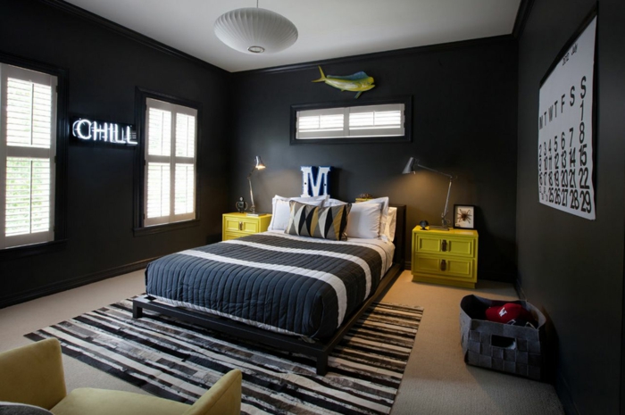 wan-gekleurde ideeën jongenskamer tapijt zwarte muren gele meubels