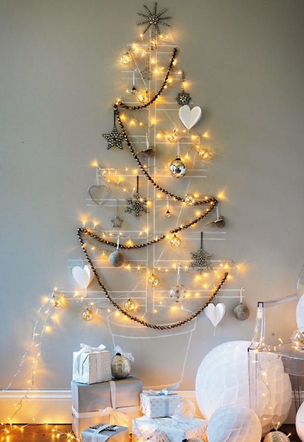 Christmas tree making on the wall with glittering tree decorations