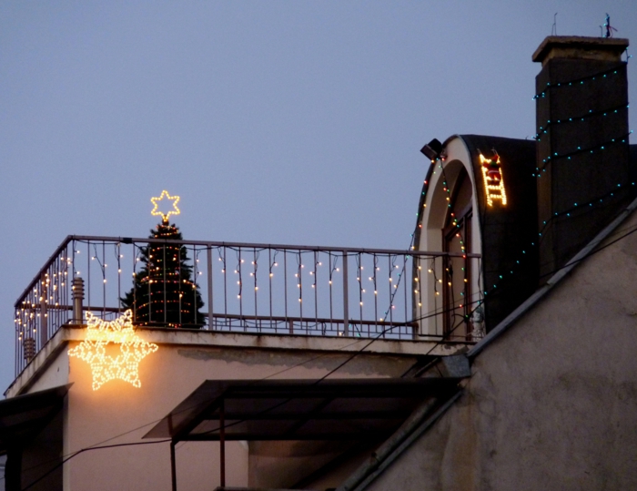 christmas decoration christmas decoration fairy lights flowerpots poinsettia balcony
