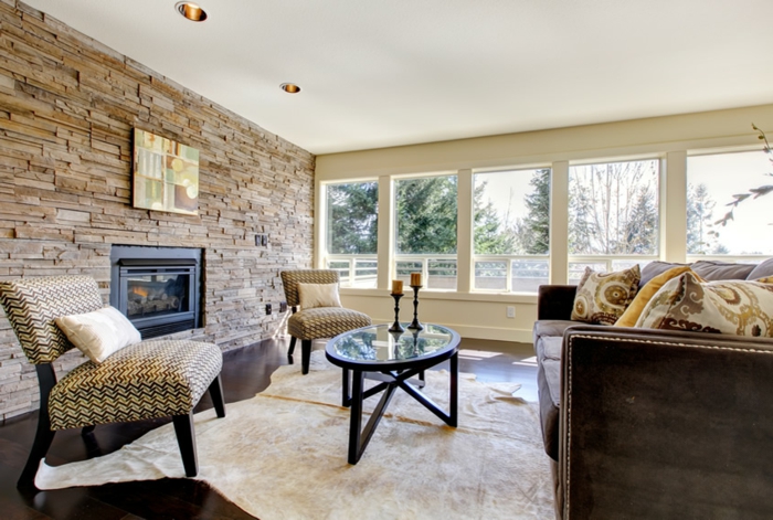 living room stone wall fell carpet fireplace candles