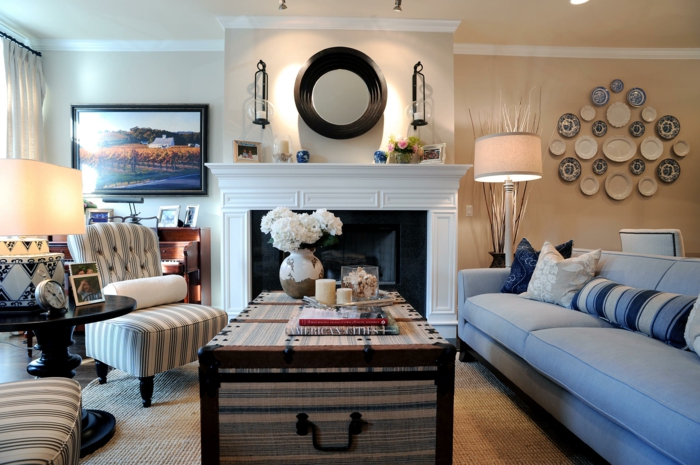 living room painting ideas beige walls sisal carpet blue sofa fireplace