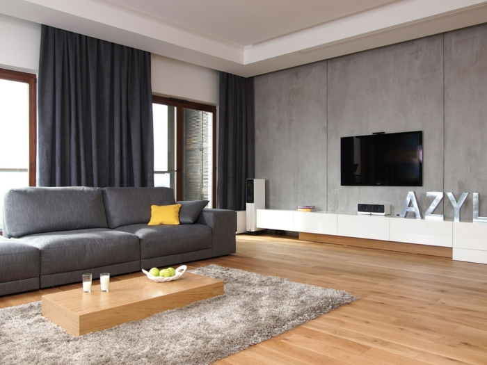 obývací pokoj nábytek nápad elegantní šedá pohovka minimalistický konferenční stolek